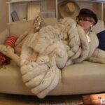 Goddess rubs pussy in fur-coat
