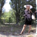 Elegant vintage lady pees in the garden